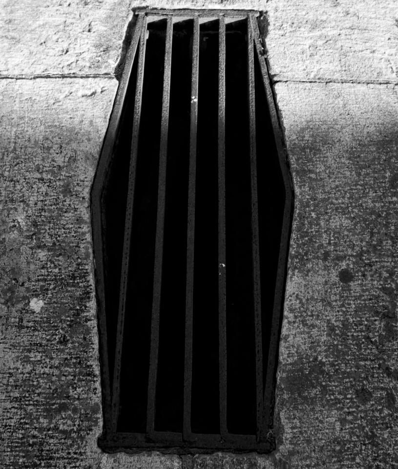A grate that reminds me of a coffin.